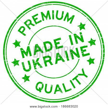 Grunge green premium quality made in Urkaine round rubber seal stamp on white background