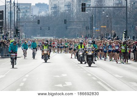 BERLIN - APRIL 03 2016: The annual Berlin Half Marathon. Race through the city streets. Start of the marathon.