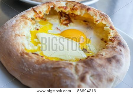 Adjarian Khachapuri With Eggs On The Table
