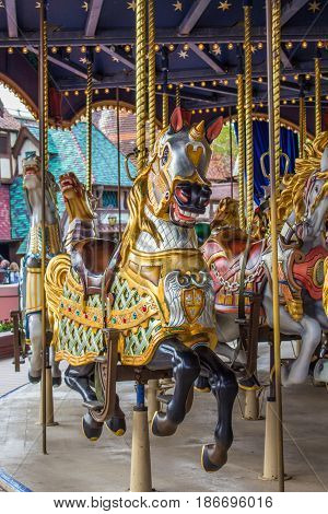 Merry go round in amusement park. 
Paris Disneyland in the spring of 2017