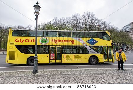 BERLIN GERMANY - APRIL 7: Yellow sightseeing bus on April 7 2017 in Berlin