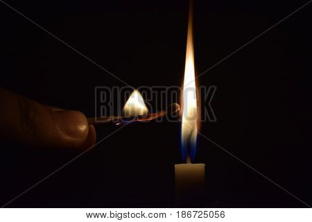 A Match Stick Burning after Lighting a Candle