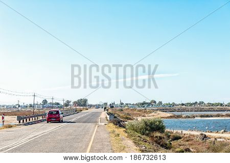 VELDDRIF SOUTH AFRICA - APRIL 1 2017: A view of a bridge over part of the Berg River with Velddrif in the back