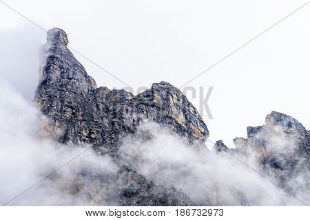 The Swiss Alps at Murren, Switzerland. Jungfrau Region. Tops of the mountains in fog and clouds.