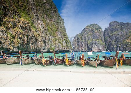 KO PHI PHI LEH, THAILAND, February 1, 2014: Traditional long tail boats on the beach of Maya Bay, Andaman Sea, famous tourist destination in the Ko Phi Phi achipelago