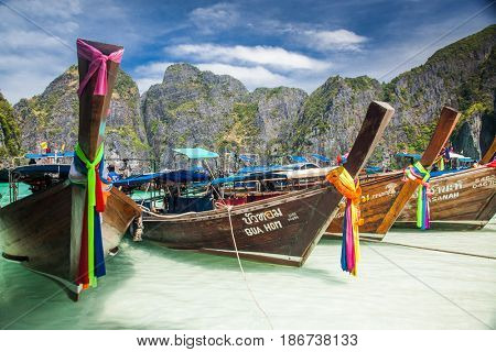 KO PHI PHI LEH, THAILAND, February 1, 2014: Traditional long tail boats on the beach of Maya Bay, Andaman Sea, famous tourist destination in the Ko Phi Phi achipelago