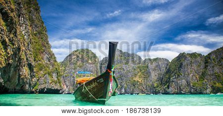 KO PHI PHI LEH, THAILAND, February 1, 2014: Traditional long tail boats on the beach of Maya Bay, Andaman Sea, famous tourist destination in the Ko Phi Phi achipelago