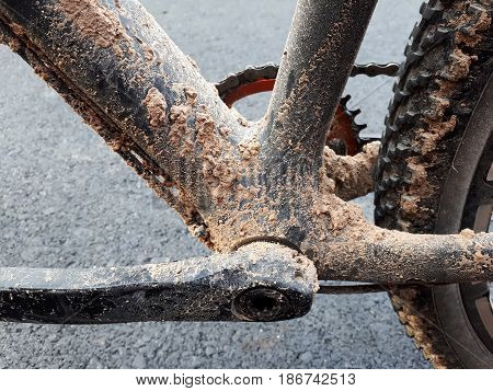 Dirty mountain bike covered with mud and dirt / Cycling in wet condition concept