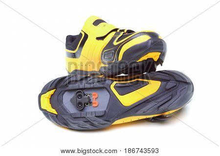 Mountain bike cycling shoes in yellow color isolated