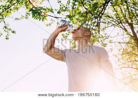 athlete is refreshing himself with water, sport and healthy lifestyle