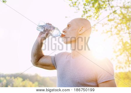 athlete is refreshing himself with water, sport and healthy lifestyle