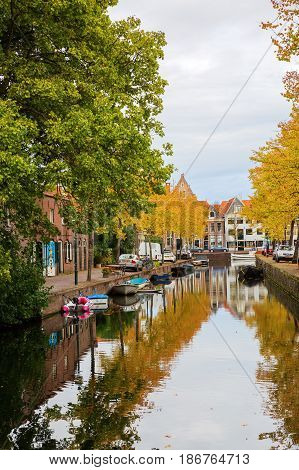 Canal With Autumn Colored Trees In Hoorn, Netherlands