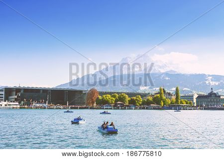 Lucerne Switzerland - April 29 2017: Beautiful lake Lucerne and pedal boat at Lucerne Switzerland with a beautiful mountain in the background.