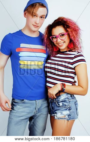 best friends teenage girl and boy together having fun, posing emotional on white background, couple happy smiling, lifestyle people concept, blond and brunette multi nations close up