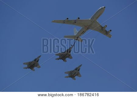 BEER SHEBA, ISRAEL - MAY 2, 2017: Boeing 707 refueling tanker in formation with F-15I all-weather multi role strike fighter during Israel's Annual Independence Day Air Force Flyover in Beer Sheba