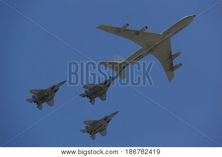 BEER SHEBA, ISRAEL - MAY 2, 2017: Boeing 707 refueling tanker in formation with F-15I all-weather multi role strike fighter during Israel's Annual Independence Day Air Force Flyover in Beer Sheba
