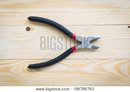 Wire cutter and wire cutter on wooden floor