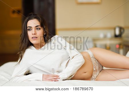 Sexy Young Woman In Lingerie Posing On The Bed