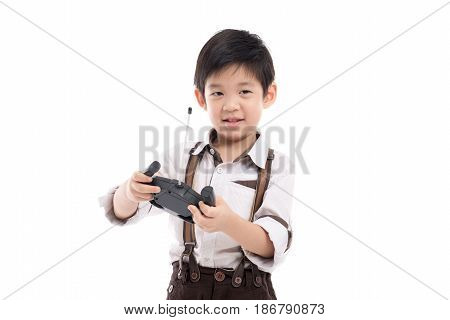 Asian child holding radio remote control on white background isolated