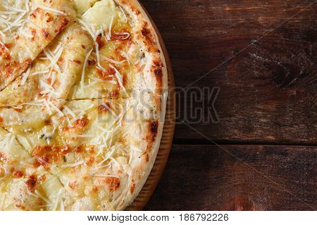 Junk food, bad habits, unhealthy eating, calories. Fresh hot cheese pizza served on rustic wooden table, flat lay with free space for text.