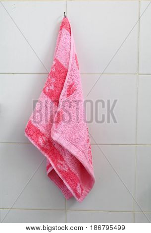 red towel for wipe hand in toliet room on wall