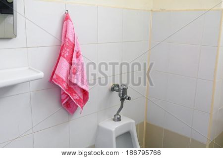 red towel for wipe hand in toliet room on wall
