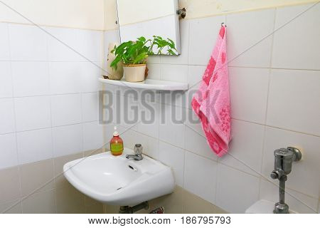 red towel for wipe hand in toliet room on wall