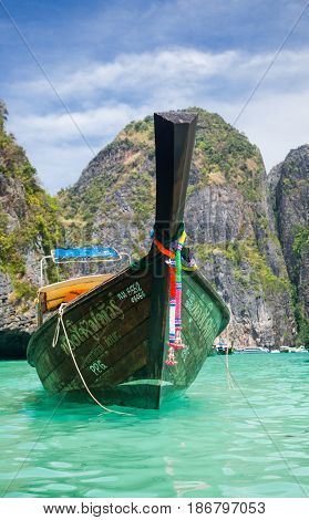 KO PHI PHI LEH, THAILAND, February 1, 2014: Traditional long tail boats on the beach of Maya Bay, Andaman Sea, famous tourist destination in the Ko Phi Phi achipelago