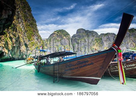 KO PHI PHI LEH, THAILAND, February 1, 2014: Traditional long tail boats on the beach of Maya Bay, Andaman Sea, famous tourist destination in the Ko Phi Phi achipelago