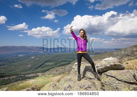 Woman On Top Of Mountain Photographing Selfie