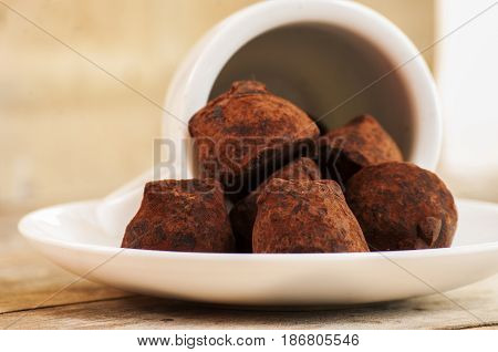 chocolate truffle close up on wooden table