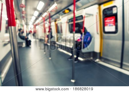 Lifestyle scene in public train. Blurred people.