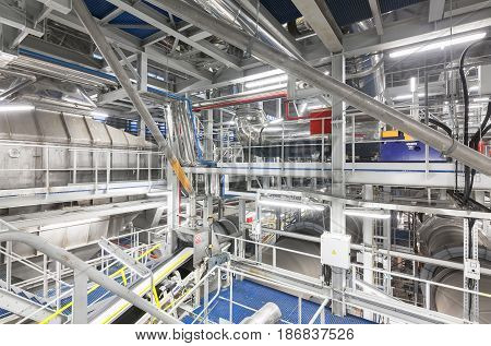 Cooling drum mold at the plant for the production of ammonium nitrate. Pipeline and equipment system at the upper levels of the chemical plant