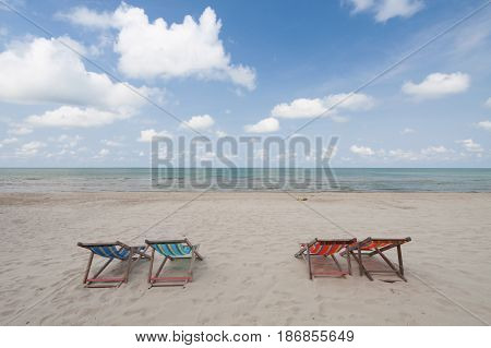 Beach chairs on perfect tropical white sand beach