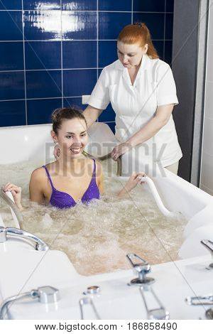 Young woman during hydromassage in beauty salon