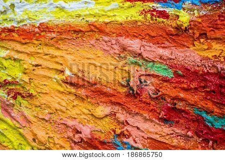 Thick dense layers of paint as abstract modern messy texture pattern surface colorful background closeup detail