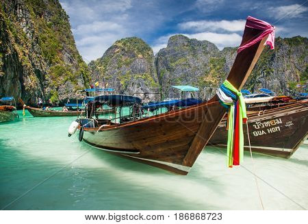 KO PHI PHI LEH, THAILAND, February 1, 2014: Traditional long tail boats on the beach of Maya Bay, Andaman Sea, famous tourist destination in the Ko Phi Phi achipelago