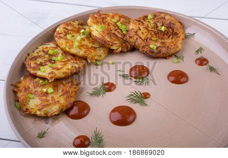 Russian draniki food served on a wooden table