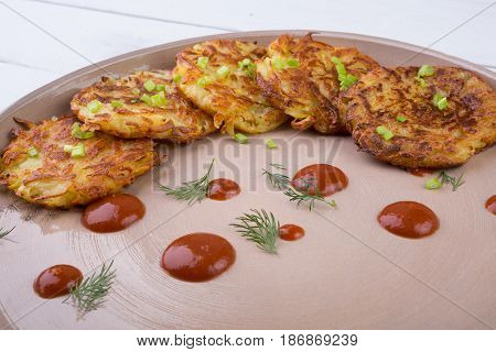 Russian draniki food served on a wooden table