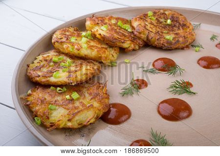 Russian draniki food served on a wooden table