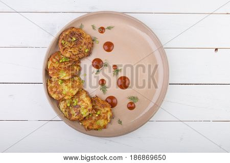 Russian draniki food served on a wooden table