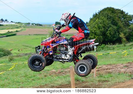 Unidentified Racer Rides A Quad Motorbike.