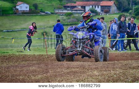 Unidentified Racer Rides A Quad Motorbike.