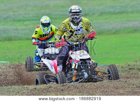 Unidentified Racers Rides A Quad Motorbike.