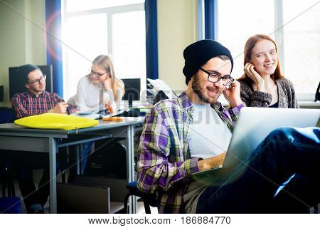 Portrait of a male student using a computer in IT class