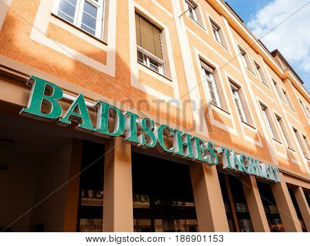 RASTATT GERMANY - APR 13 2017: Badische Tagblatt signage above the entrance of to the press building in Rastatt city. Badische Tagblatt is a newspaper covering Baden-Wurttemberg land