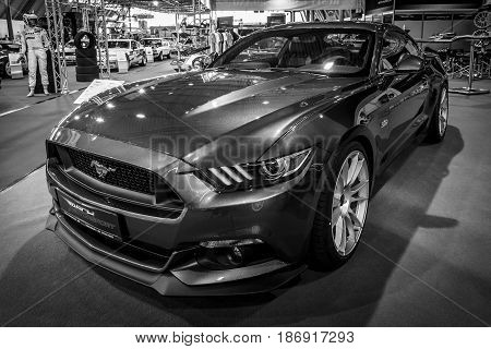 STUTTGART GERMANY - MARCH 03 2017: Pony car Ford Mustang GT V8 Fastback Coupe 2016. Black and white. Europe's greatest classic car exhibition 