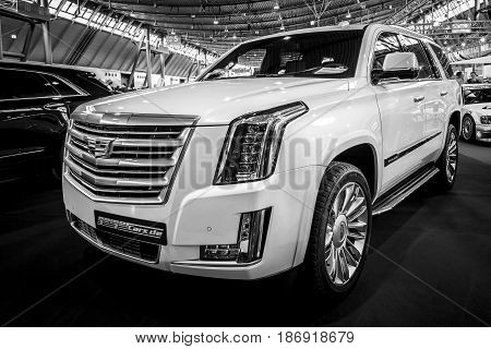 STUTTGART GERMANY - MARCH 03 2017: Full-size luxury SUV Cadillac Escalade Platinum 2017. Black and white. Europe's greatest classic car exhibition 