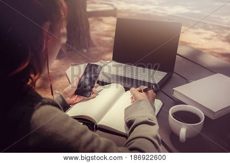 Woman working in a natural garden on vacation.