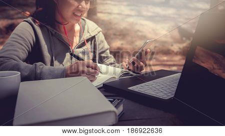 Woman working in a natural garden on vacation.